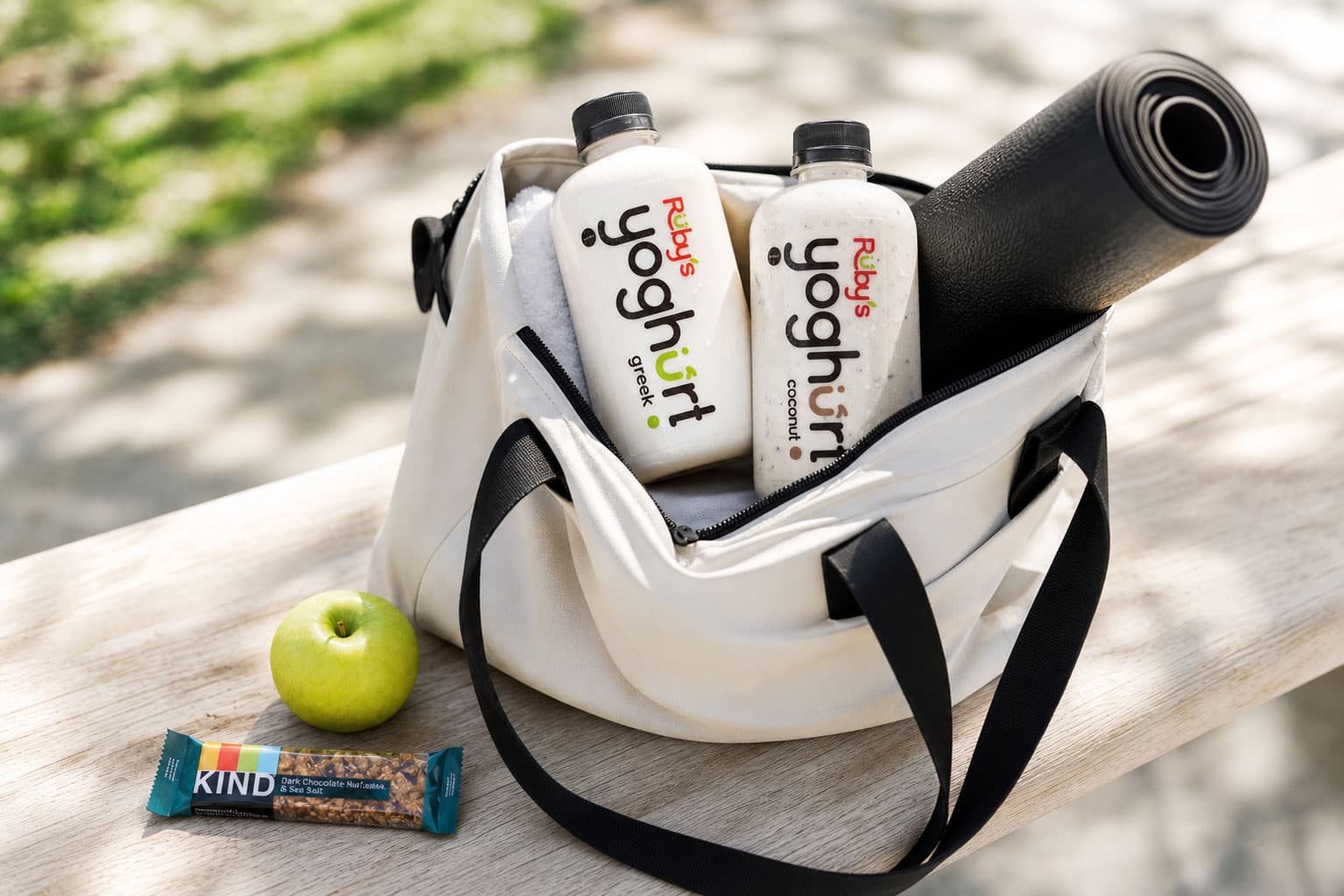 Ruby's yoghurt in a gym bag with a mat